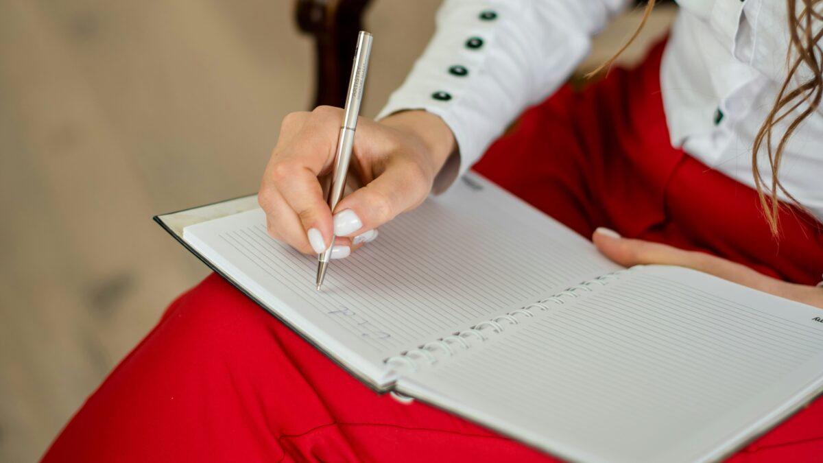 woman taking notes